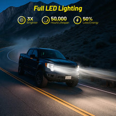 A black Ford F-150 driving at night, showcasing the powerful illumination of the full LED headlights which are 3x brighter than stock.